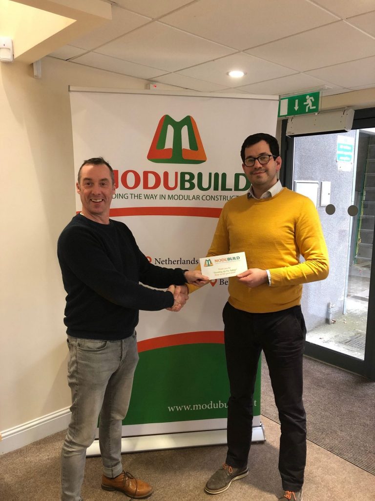 MD Kevin Brennan presents Pre-Contracts Manager James Blanchfield with safety voucher